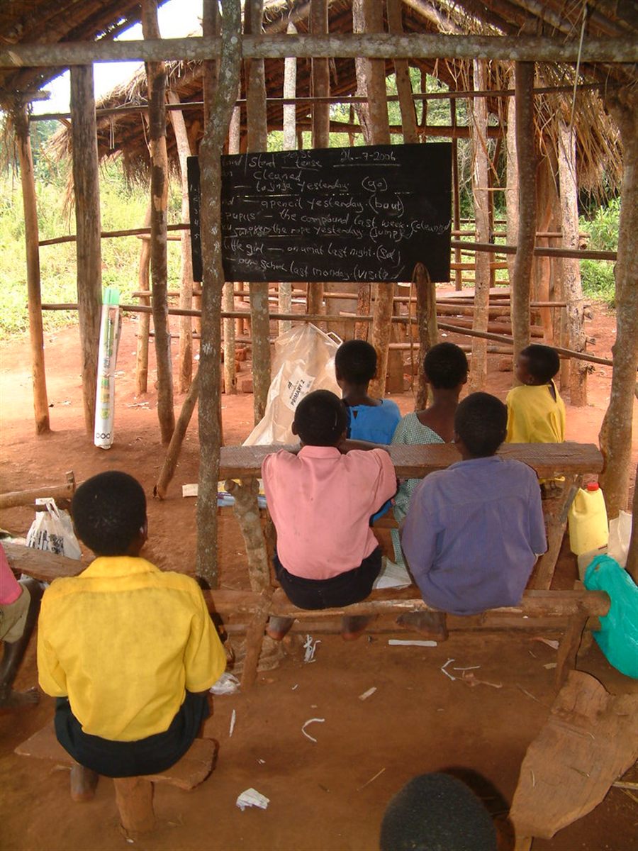 Children attending an outdoor rural classroom in Kibale, Uganda
