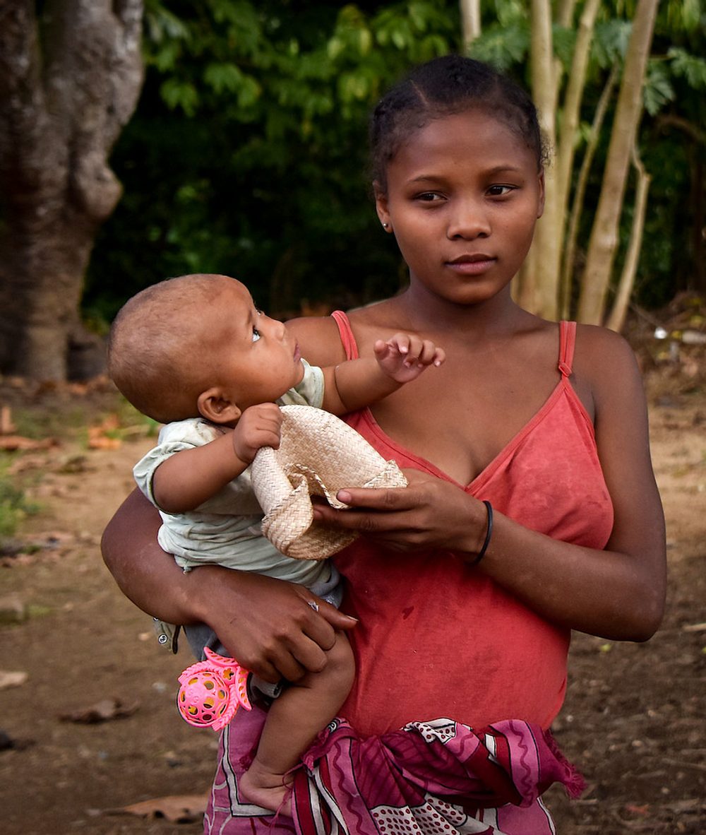 A mother holding her child